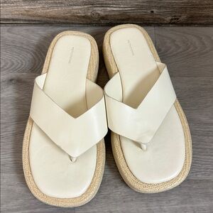 Cream Sandals with Woven Sole run large. More like 7.5/8
